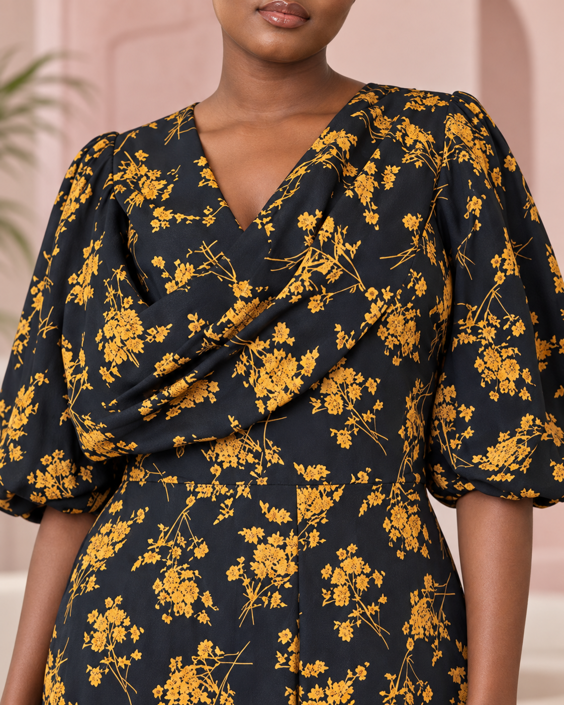 Close-up of the black and mustard floral ruffle maxi dress bodice and fabric